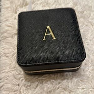 Black and gold small travel jewelry case